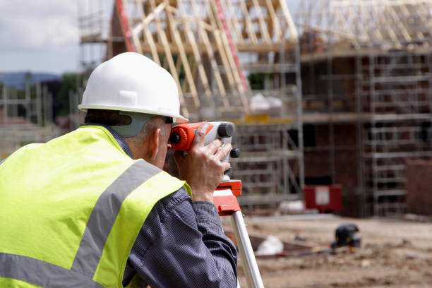 Surveyor instrument is for measuring level on construction site. Surveyors ensure precise measurements before undertaking large construction projects.