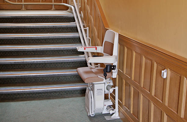 The dark green background in the picture is a ladder that is regularly used by repairmen. It is an aluminum frame with silver and pastel blue colors used in the repair work and for convenience and com