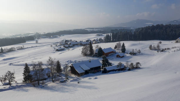 istock aerial flight over snow covered german village in winter 1127954368