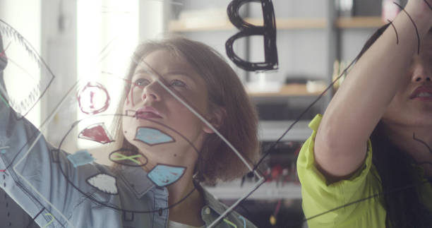 istock Working together gives better results. Startup company team brainstorming 1127954546