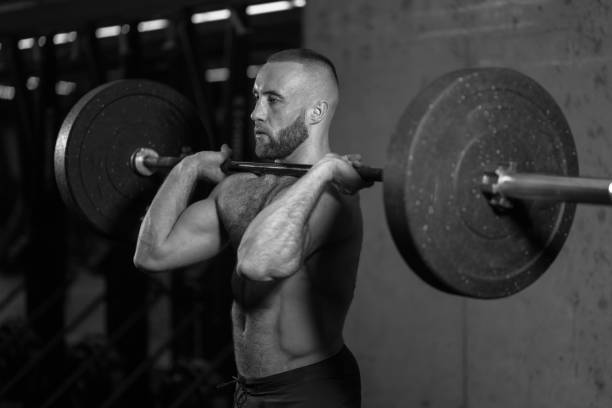 istock black and white photo. gym training with barbell 1127955789