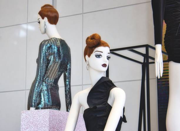 istock White fashion mannequins displaying elegant clothes 1127955875
