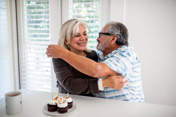 Senior couple celebrating a birthday and hugging each other