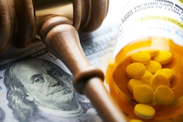High Cost of Prescription Drugs: Concept of legislation prescription bottles with gavel High Cost of Prescription Drugs: Concept prescription bottles with gavel recreational drug stock pictures, royalty-free photos & images
