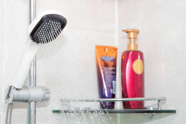 istock shower head with running water in a bathroom 1127959333