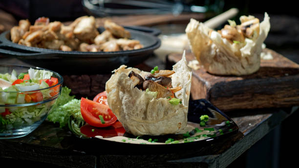 istock Preparing salad with chicken, mushrooms and fresh vegetables 1127959465