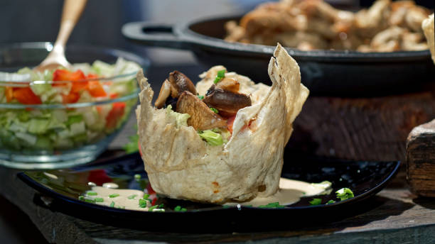 istock Preparing salad with chicken, mushrooms and fresh vegetables 1127959483