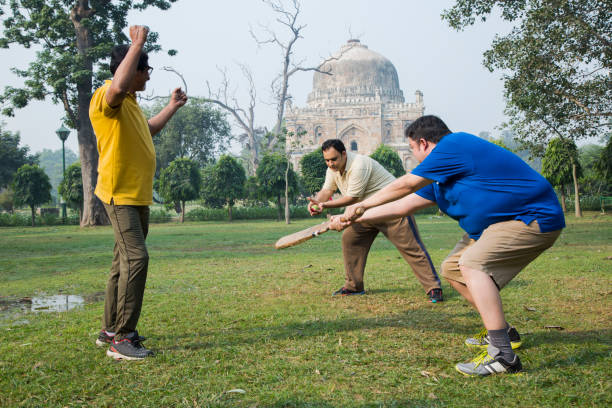 istock Playing Cricket - stock images 1127960794
