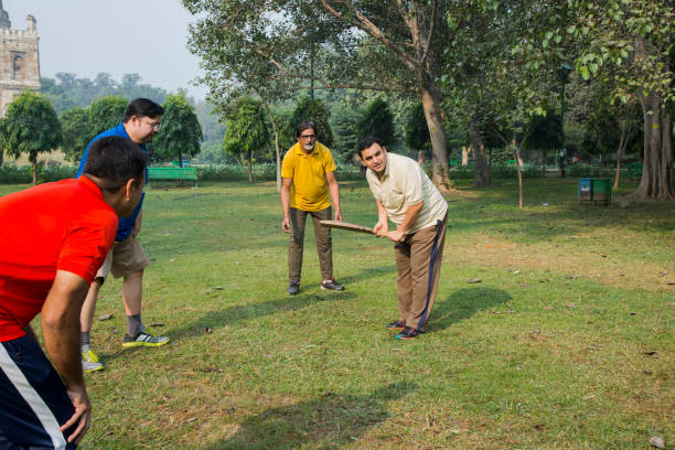 istock Playing Cricket - stock images 1127961068