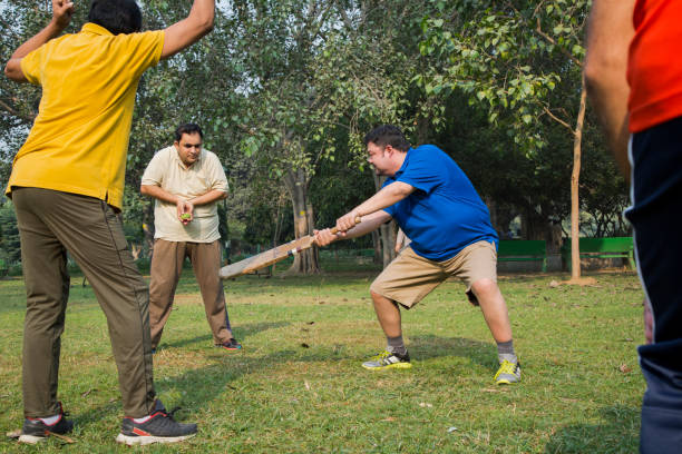 istock Playing Cricket - stock images 1127961144