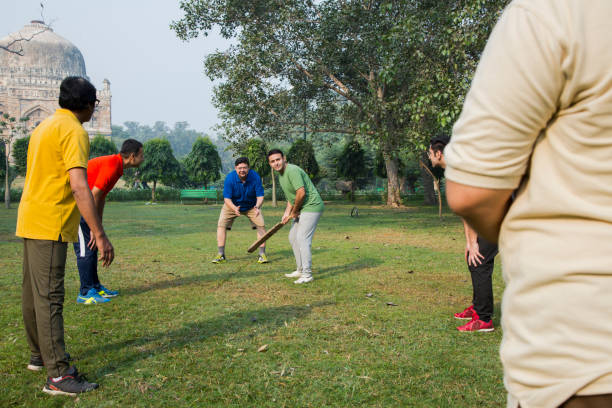 istock Playing Cricket - stock images 1127961351