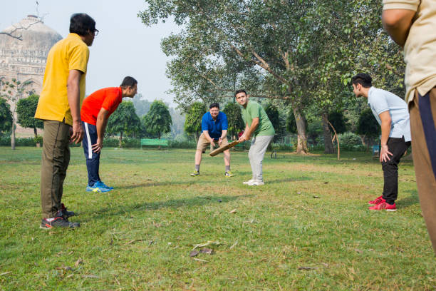istock Playing Cricket - stock images 1127961460