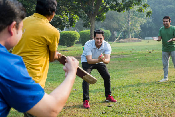 istock Playing Cricket - stock images 1127962234