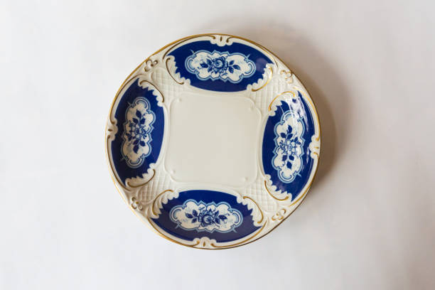 navy round plate on white background,blue dish