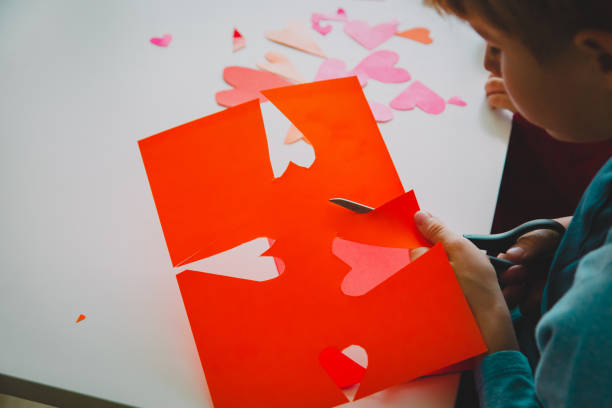istock kids making hearts from paper, prepare for valentine day 1127962400