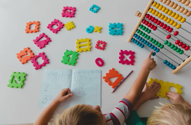 istock little girls learn to write and culculate numbers 1127962715