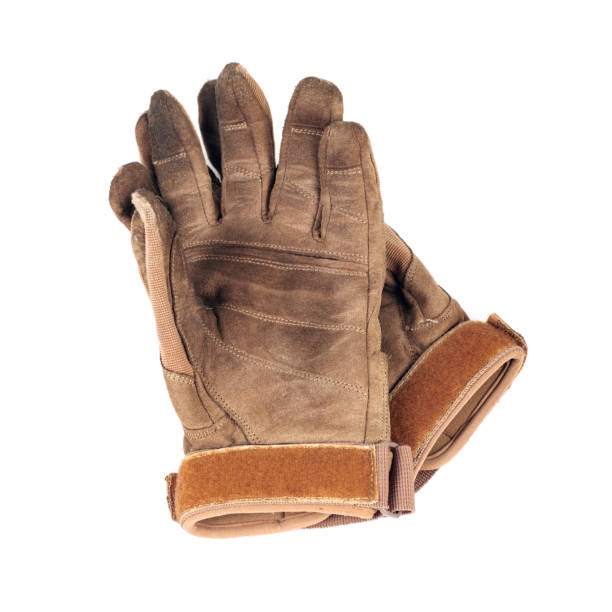 istock old gloves, leather, brown, isolated on white 1127964123