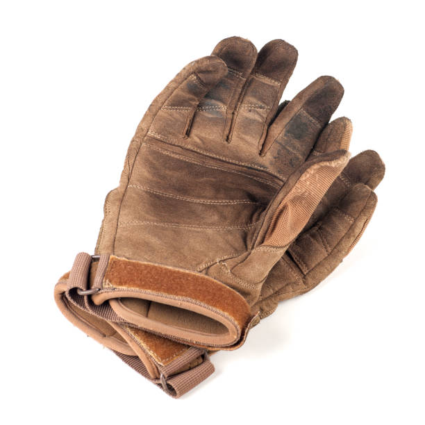 istock old gloves, leather, brown, isolated on white 1127964195