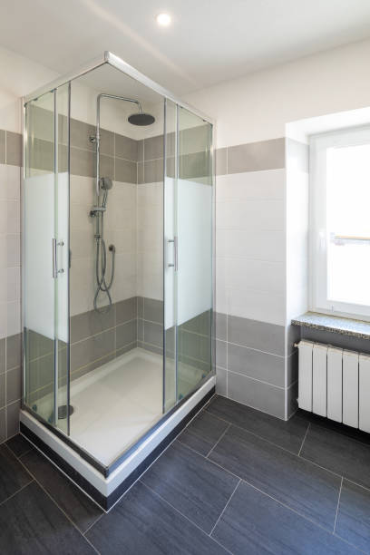 istock Bathroom with gray tiles and nobody inside 1127964287