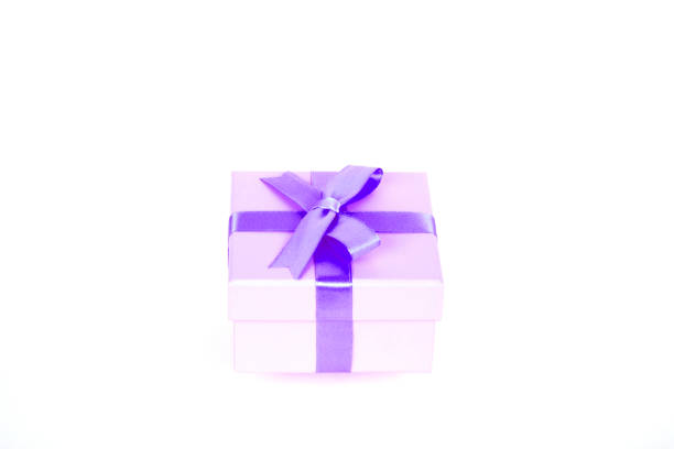 istock gift box with purple bow and white background 1127965572