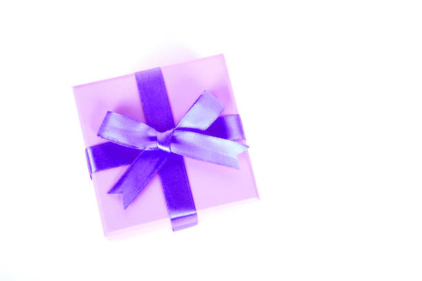 istock gift box with purple bow and white background 1127965592