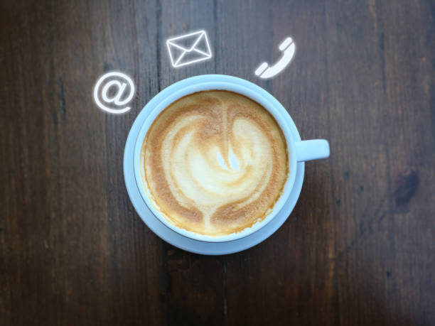 istock Contact us coffee office desk table support corporate service information 1127965714