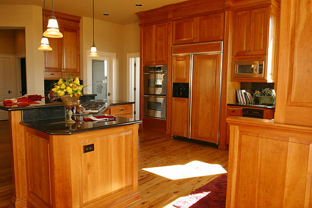 istock warm wood styled kitchen hardwood floors and hanging lights 112796737