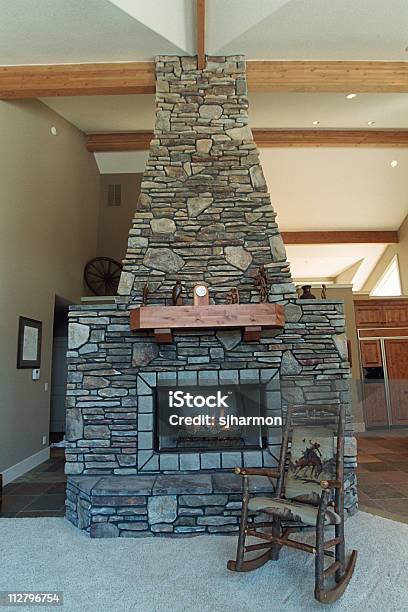 Home Rustic Fireplace Stock Photo - Download Image Now - Arranging, Burning, Chair