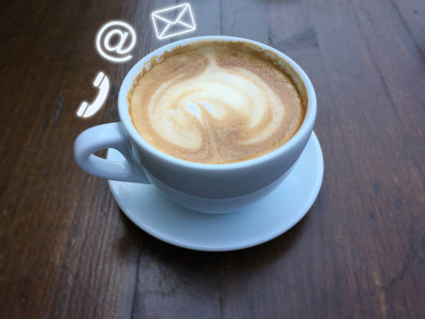 istock Contact us coffee office desk table support corporate service information 1127968153