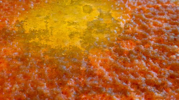 istock Close up of melted cheese with yellow centre and textured effect 1127968299
