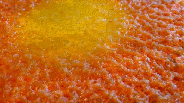 Close up of melted cheese with yellow centre and textured effect