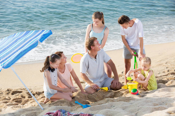 istock Parents with four children playing 1127968431