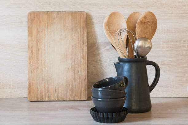 istock Crockery, clayware utensils and different stuff on wooden tabletop. Kitchen still life as background 1127968843