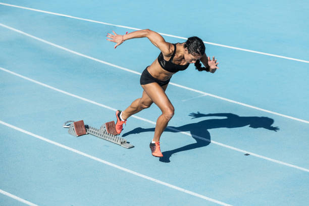 istock young woman training on running track 1127969682