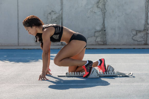 istock athlete woman in starting position 1127969692