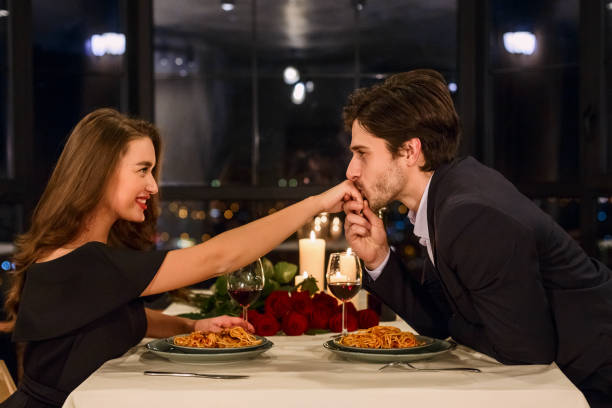 istock Man kissing hand of his girlfriend. 1127969708