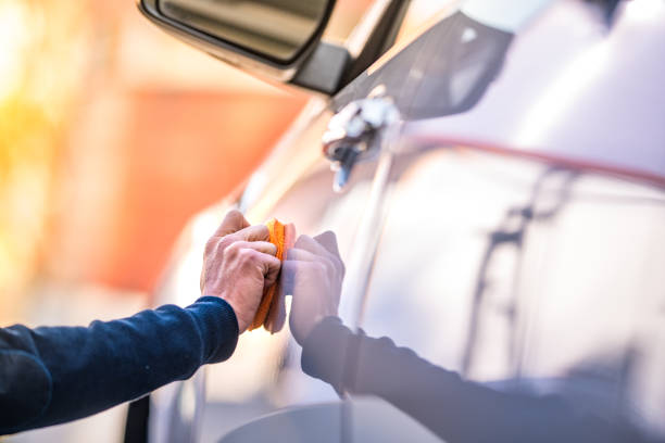 istock Mature man polishing car with applicator pad 1127970145