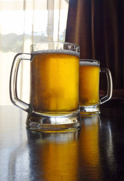 istock Two craft beer glasses on the table 1127971285