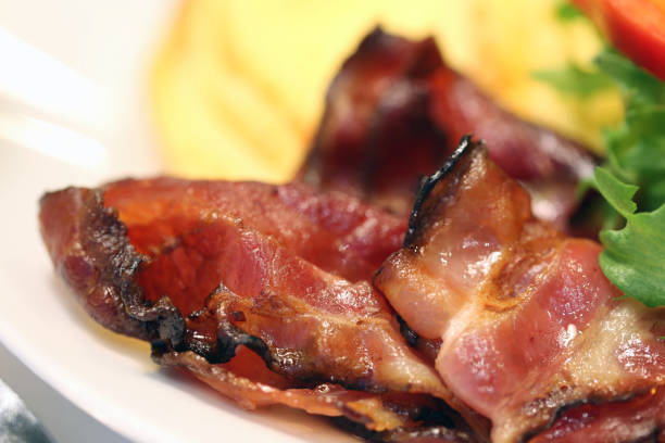istock Breakfast: Omelette, Bacon & Veggies on a White Plate 1127971968