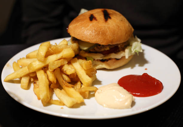 istock Hamburger and Fries on a White Plate 1127972071