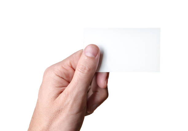 istock man holding blank visitcard,showing visit card 1127972185