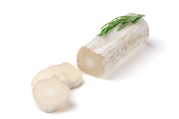 istock Stick of a goat cheese on paper on  the white background. 1127973151