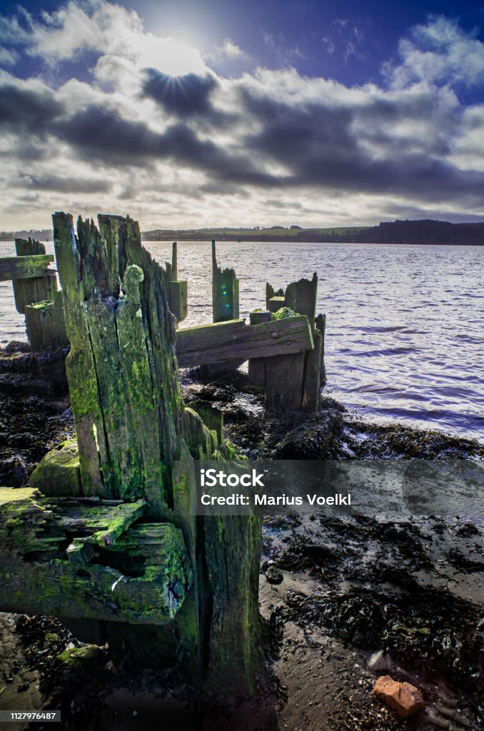 Old Harbour in Scotland Old wooden Harbour in Scotland Cloud - Sky Stock Photo