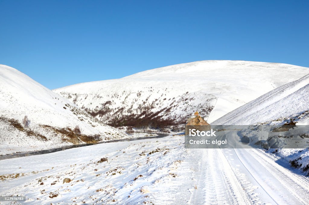 Winter in Glen Avon, Cairngorms mountains, Scotland, UK Snow in winter wilderness, Scottish Highlands Beauty In Nature Stock Photo