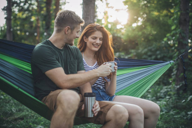 istock Young couple enjoy in hammock 1127976839