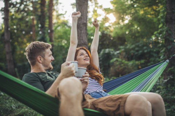 istock Young couple enjoy in hammock 1127976956