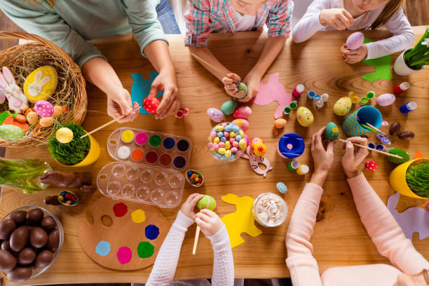 istock Top above high angle view of work place table group of people hands doing making dying modern decor accessory things classes courses studying ginger cookies bakery indoors 1127978132