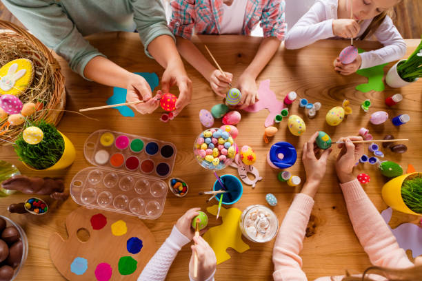top above high angle view of work place table nice group of people hands doing making decor accessory things classes courses studying in house indoors - easter easter egg eggs spring imagens e fotografias de stock