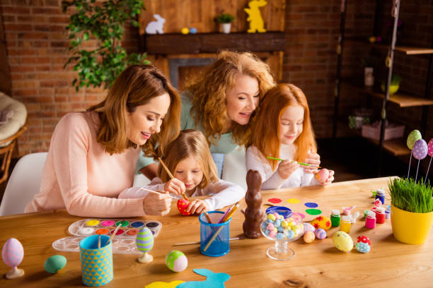 istock Nice attractive cheerful ladies girls doing self made decorative materials festive preparation in house brick loft industrial interior room indoors 1127982431