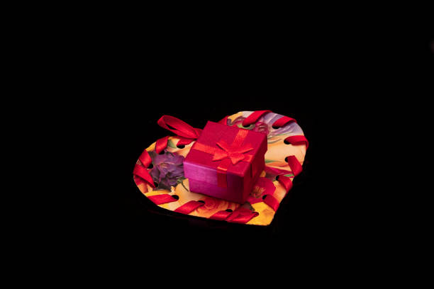 istock Colorful gift on a black background 1127982998